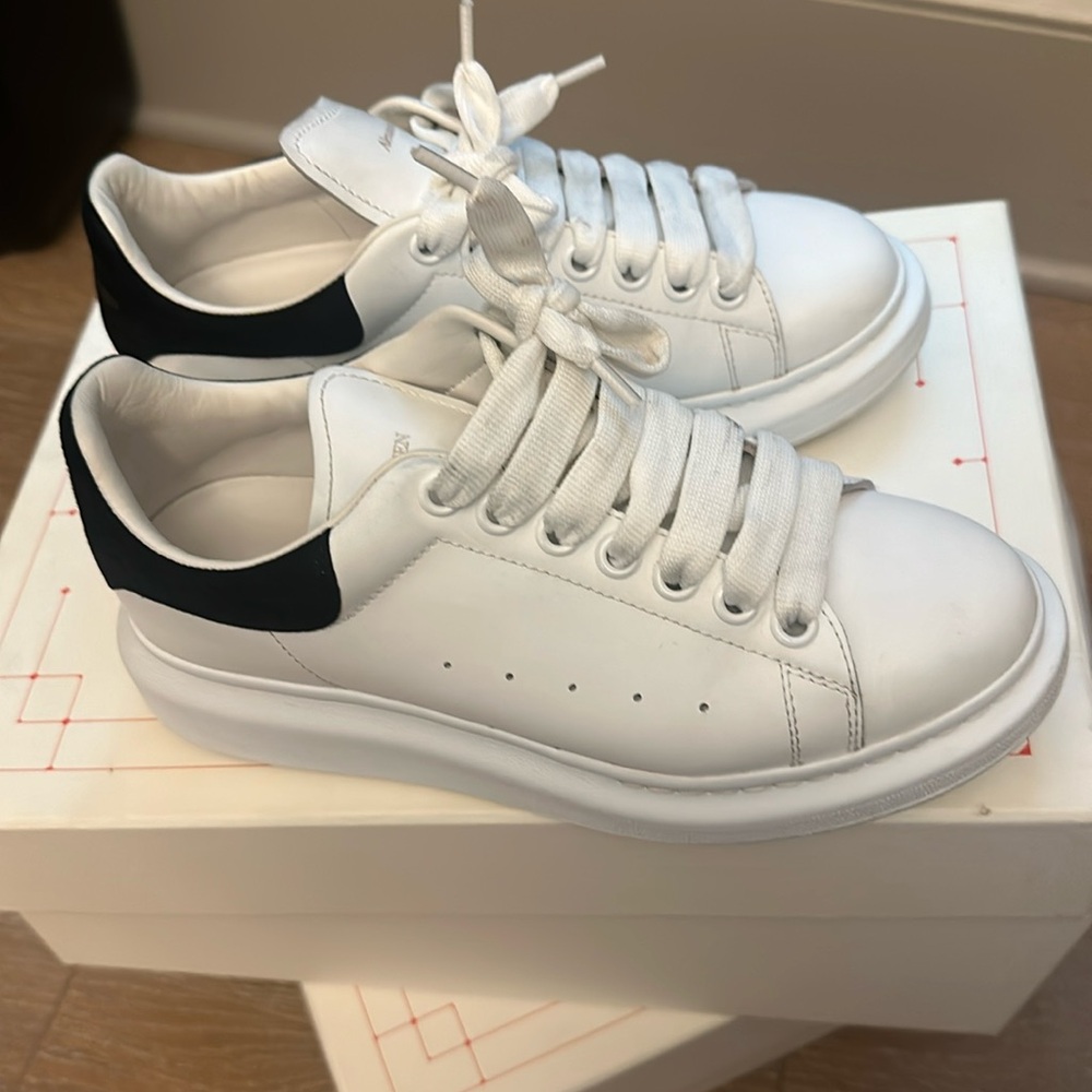 Alexander McQueens Black and White sneakers for sale.